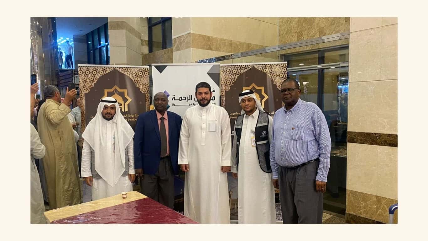 Bawabet Al-Miqat team welcoming Umrah pilgrims at the branded reception in Makkah