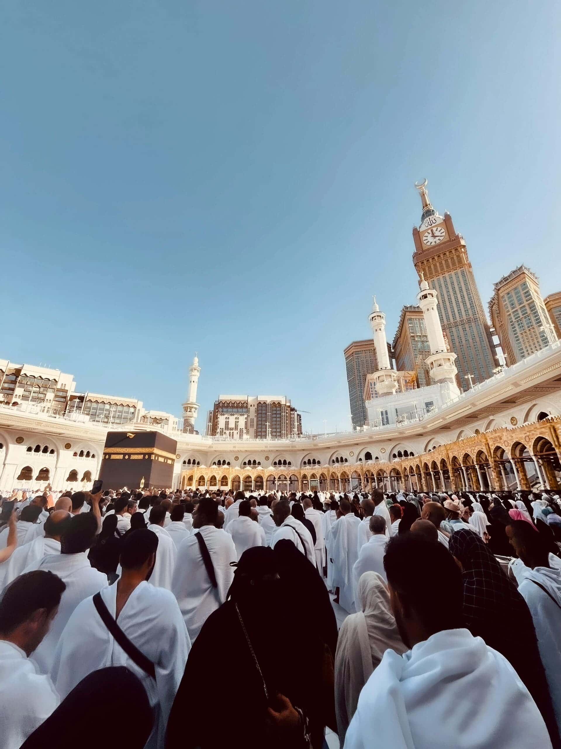 Umrah pilgrims before the Makkah Clock Tower near Masjid al-Haram