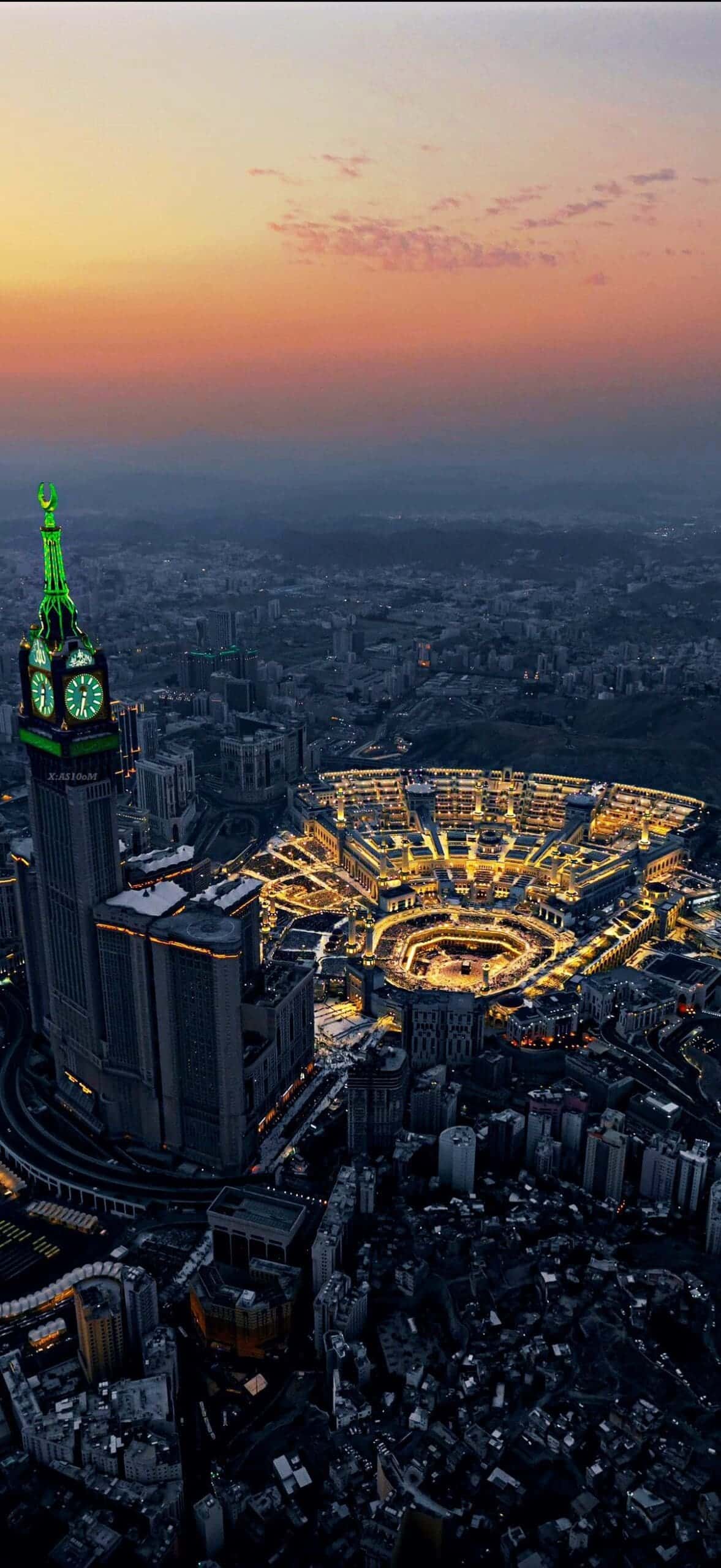The Makkah Royal Clock Tower rising above the Grand Mosque at sunset
